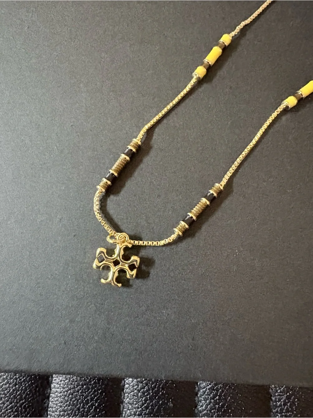 Tory Burch Gold Cross Pendant Necklace with Black Beads